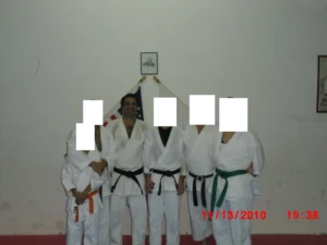 David with his karate Sensei and fellow students. I cut the faces of the other people to respect their privacy.